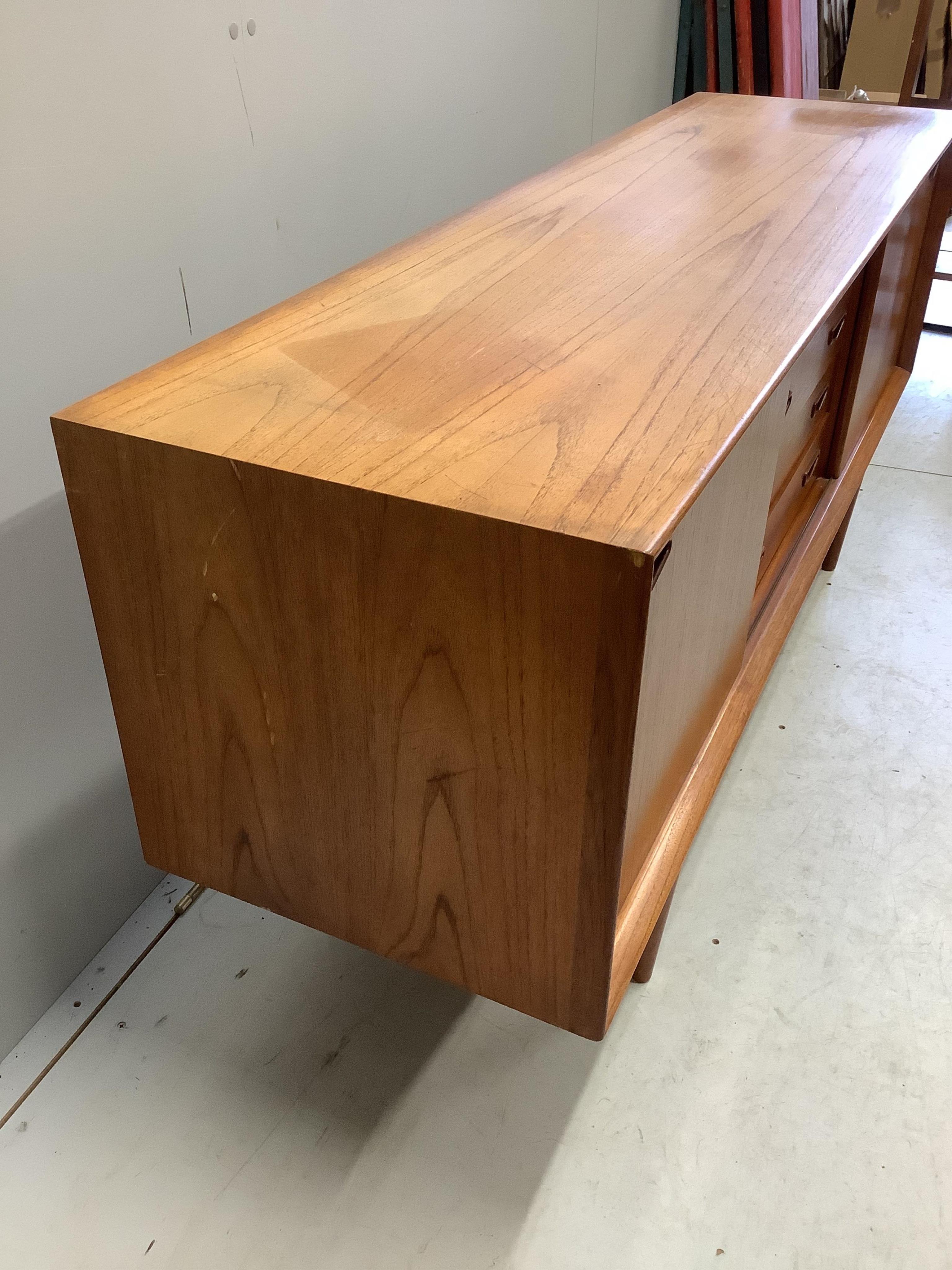 Clausen & Son, a mid century Danish teak sideboard, width 160cm, depth 45cm, height 70cm. Condition - fair